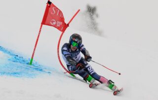 Patrick Kenney carving a turn at the Palisades, Lake Tahoe World Cup. Credit: Steven Kornreich