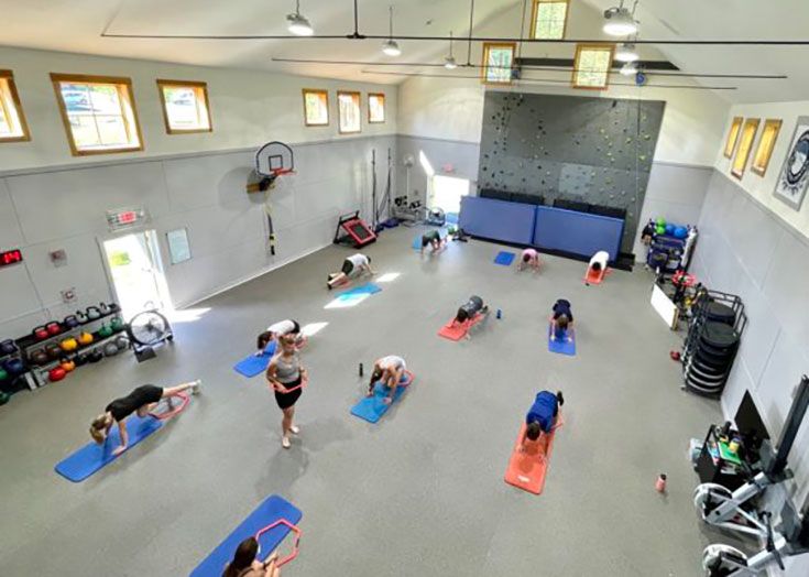 Mt. Mansfield Academy athletes training in gym facility.